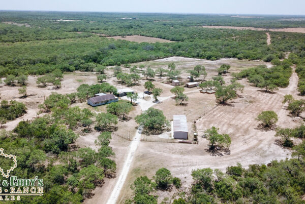 Aerial view of a sold Atascosa County ranch with home and outbuildings