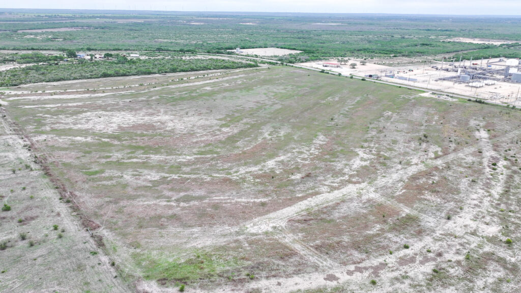 Aerial view of gently rolling pasture on Three Rivers Development Tract