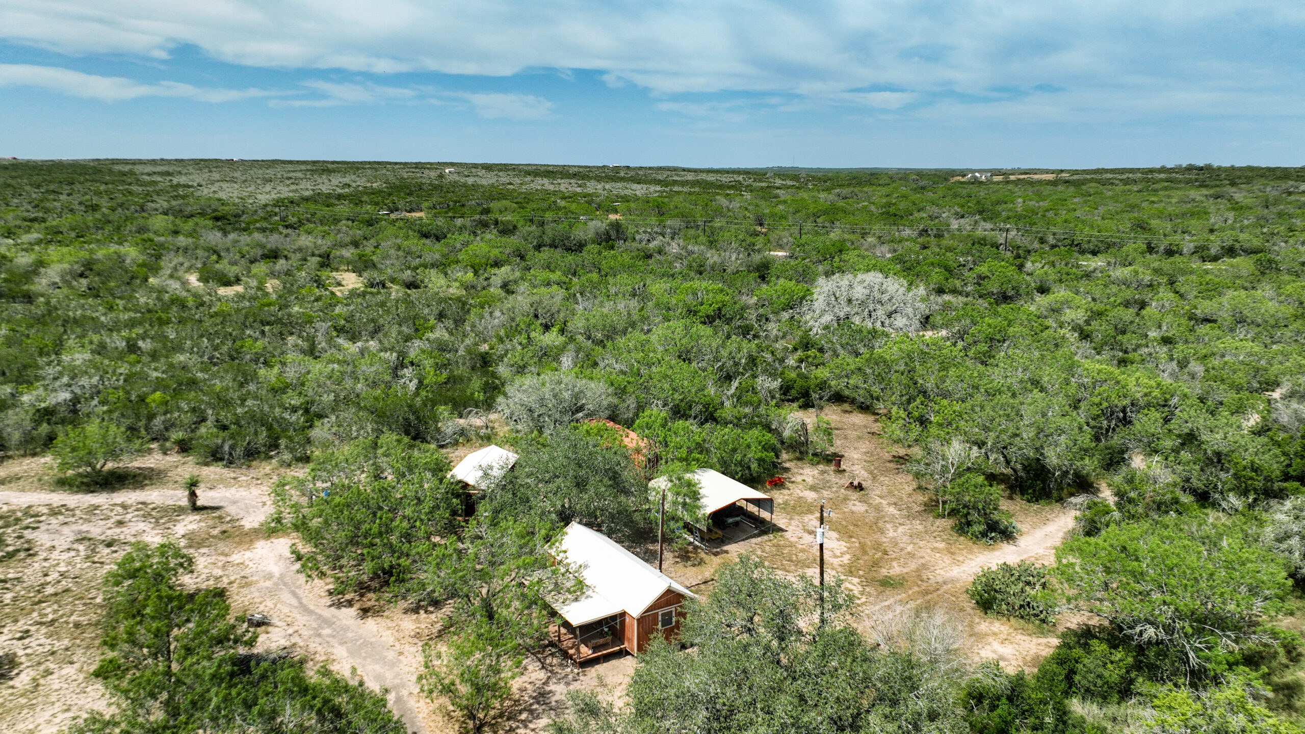Two furnished hunting cabins with porches on 40 acres in Live Oak County Texas