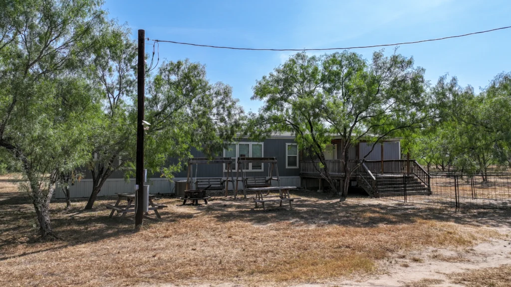 Home with power service and back deck at Sand Branch Homestead