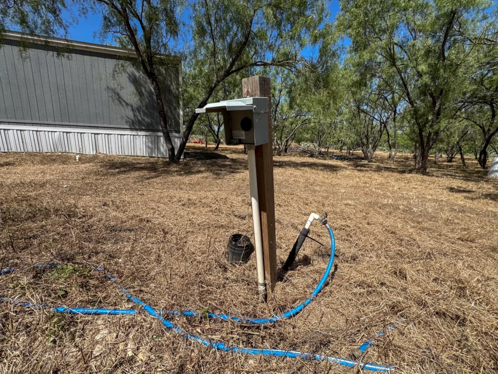 Water hookup beside the home at Sand Branch Homestead