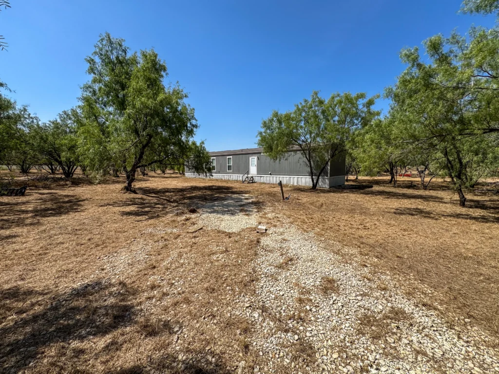 Gravel drive leading to the home at Sand Branch Homestead