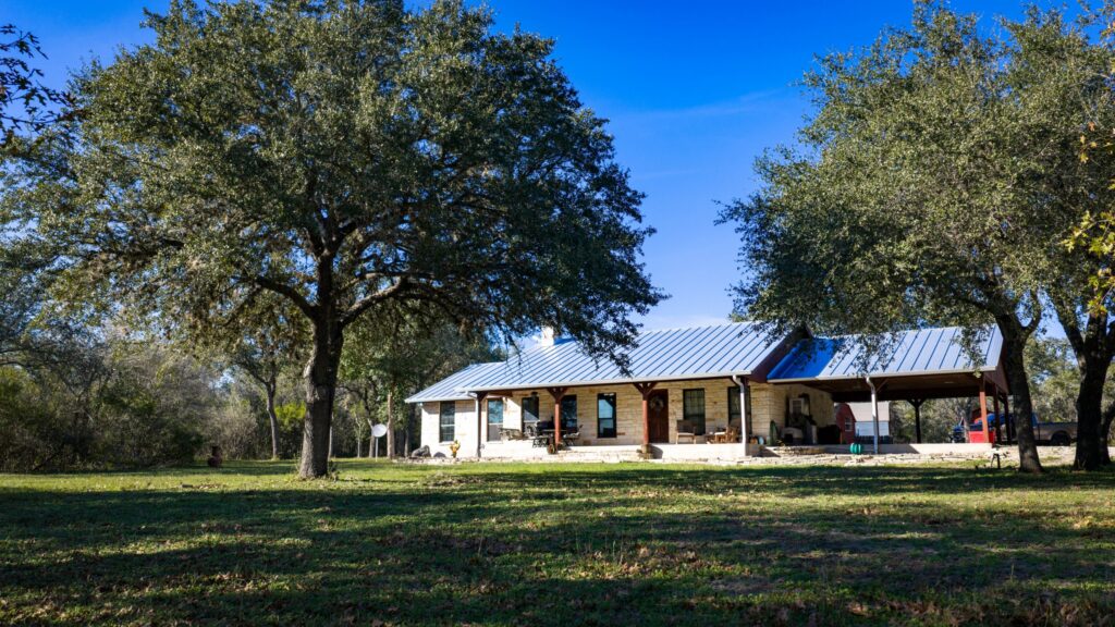 Home tucked into the live oaks at Back 40 Ranch