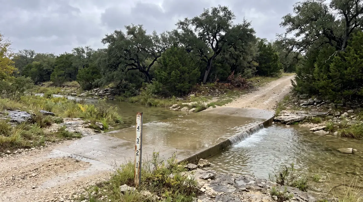 Low-water crossing on a rural Texas ranch road after rain